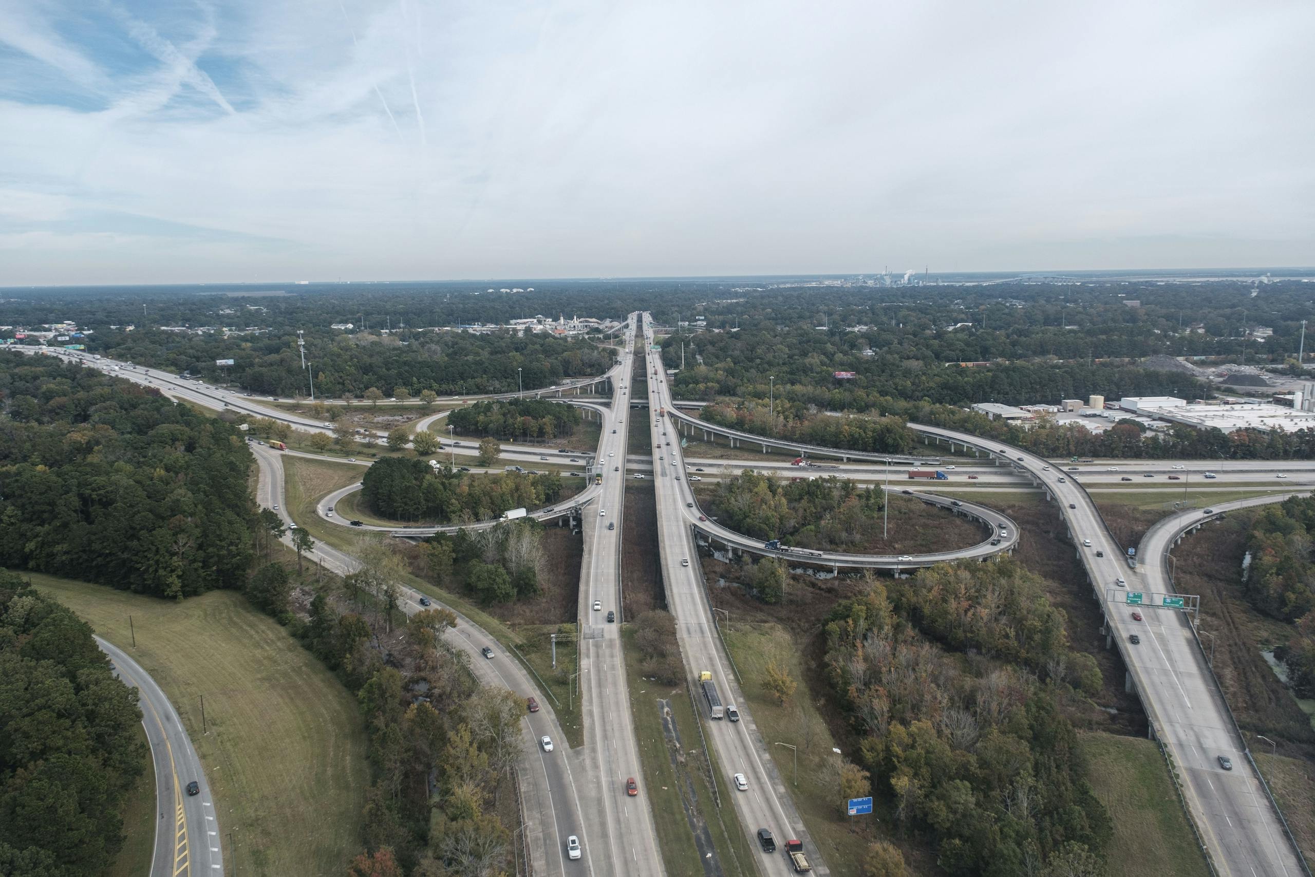 Aerial view of a detailed highway interchange in Charleston, SC, showcasing traffic flow and urban planning.