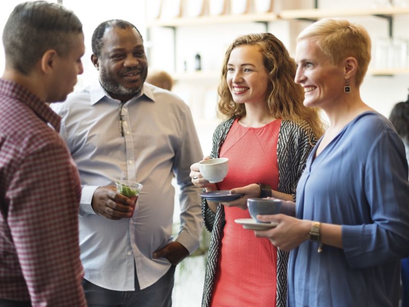 colleagues talking at company event